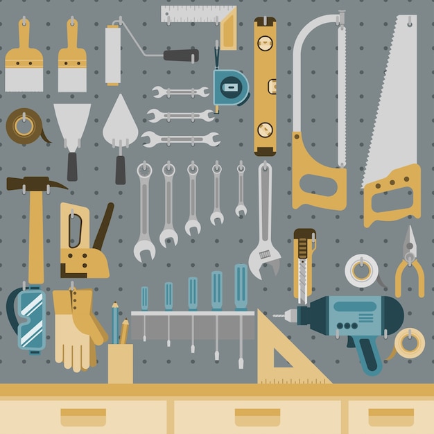 Set of tools hanging on peg board wall