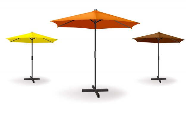 Set van drie paraplu's in verschillende kleuren oranje, geel, donkeroranje.