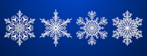 Set van prachtige complexe kerstsneeuwvlokken, wit op blauwe achtergrond