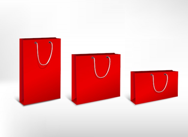 Set van rode papieren zakken van verschillende grootte. afbeelding met hoge resolutie. geïsoleerd op een witte achtergrond.