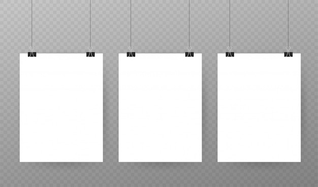 Set veelkleurige bindmiddelklemmen op een stuk papier op transparant