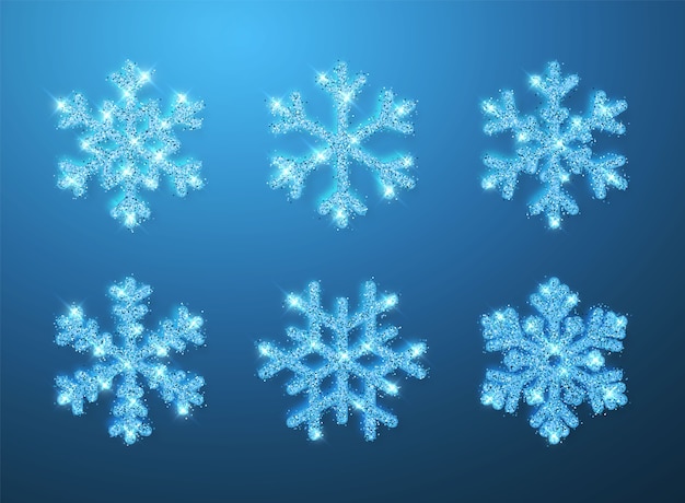 青い背景に輝く青いキラキラ輝く雪片。クリスマスと新年の装飾。