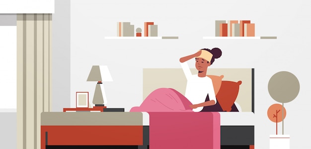 Vector sick woman with wet towel on forehead unhealthy african american girl reducing high fever suffering from cold flu virus illness concept modern living room interior full length horizontal