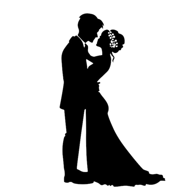 A silhouette of a bride and groom kissing