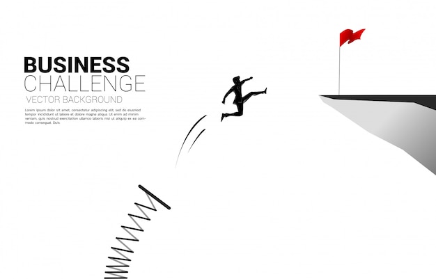 Silhouette of businessman jump to red flag on cliff with springboard. concept of boost and growth in business.