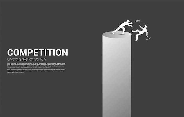 Silhouette of businessman push the other falling down from the tower. concept for business competition and challenger.