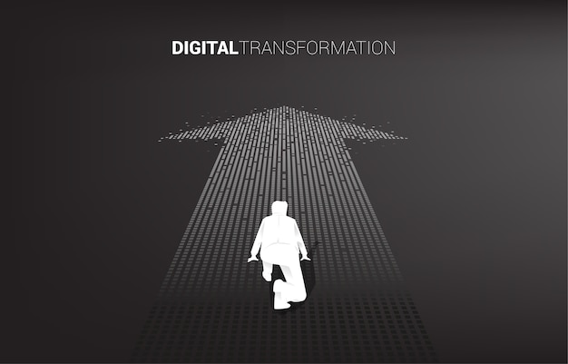 Silhouette of businessman in ready position on the arrow from pixel. concept of digital transformation of business.