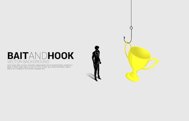 Silhouette of businessman standing with fishing hook with trophy. concept of bait and hook in business rewards.