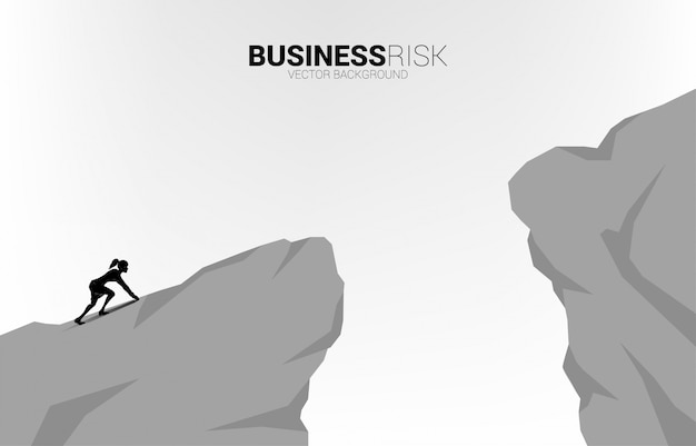 Silhouette of businesswoman ready to run to jumping over the gap. concept of business challenge risk.