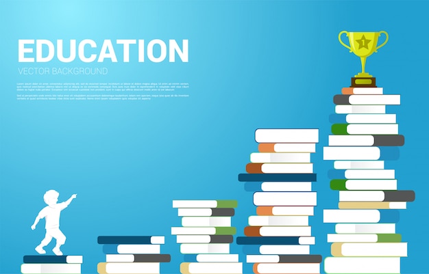 Silhouette of kid look up to trophy on stack of books