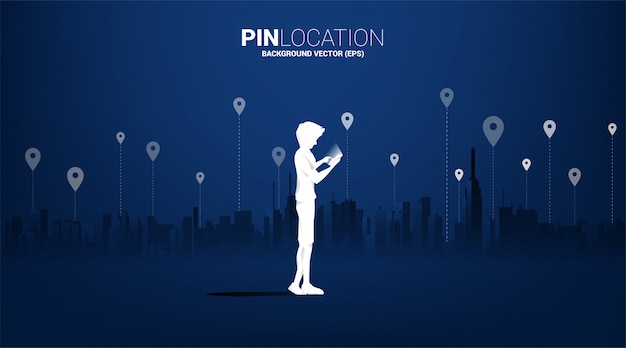 Silhouette of man with mobile and gps icon with city background. concept of location and facility place , gps technology