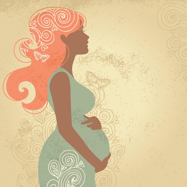 Silhouette of pregnant woman in flowers