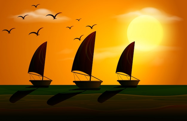 Silhouette scene with sailboats at sunset