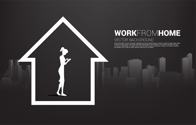 Silhouette of woman use mobile phone in home with city background. Concept for remote work from home and technology.