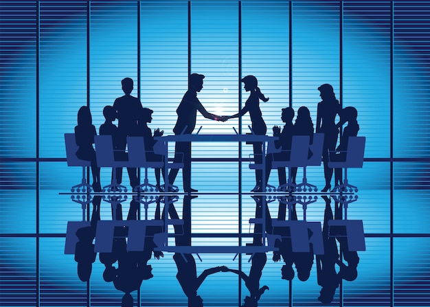 Silhouettes of Business partnership handshake