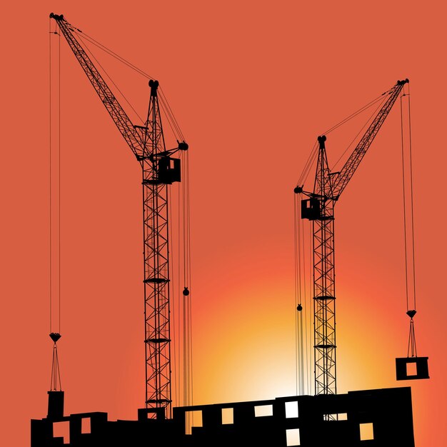 Silhouettes of crane on building against