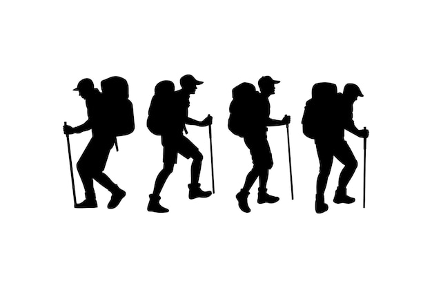 silhouettes of hikers trekking through mountainous terrain