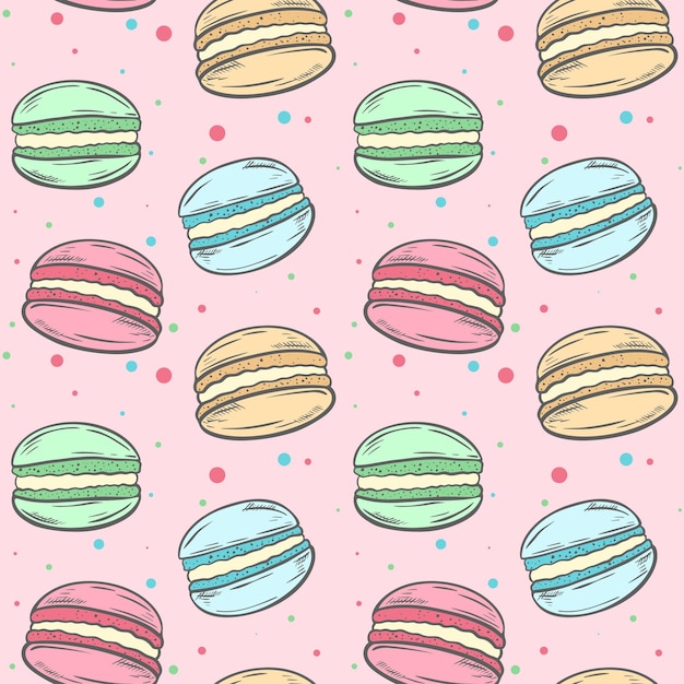 Small cute multicolored cakes on a pink substrate with speckles seamless pattern