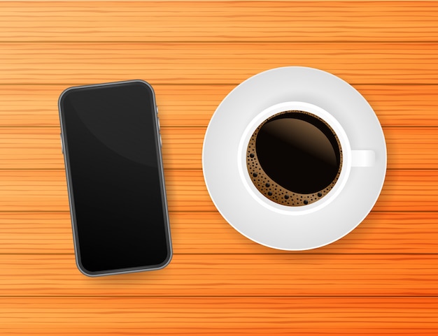 Smartphone met kop sterke koffie op hout