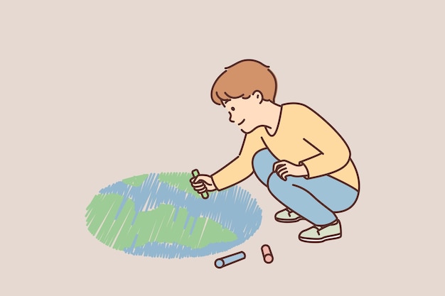 Smiling boy child draw planet on ground