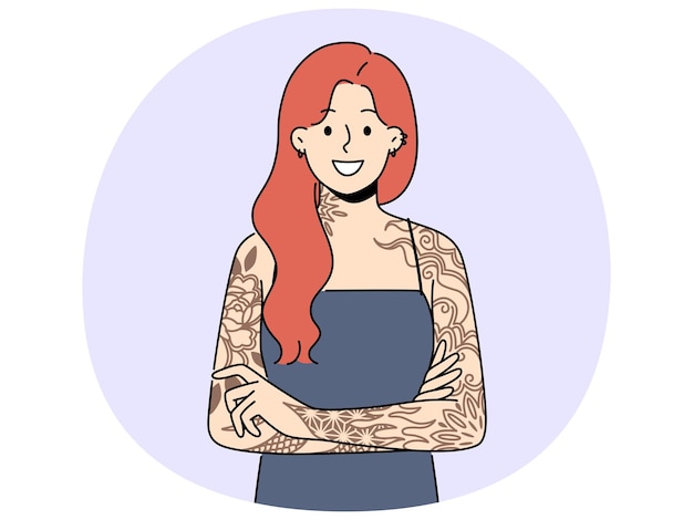 Smiling redhead woman with tattoos on arms