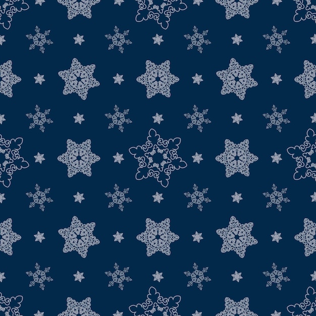 Sneeuwvlokken op een blauw patroon als achtergrond