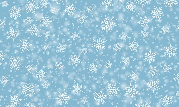 snow background. winter snowfall. white snowflakes on blue sky. christmas background. falling snow.