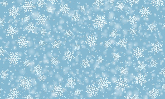 Snow background. Winter snowfall. White snowflakes on blue sky. Christmas background. Falling snow.