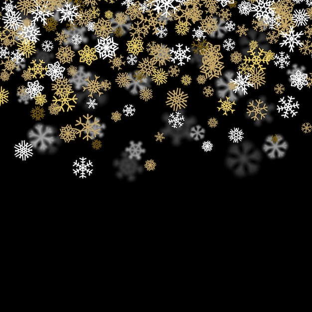 Snowfall background with golden snowflakes blurred in the dark
