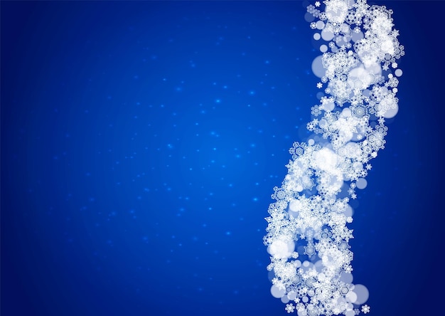 Snowflakes falling on blue background