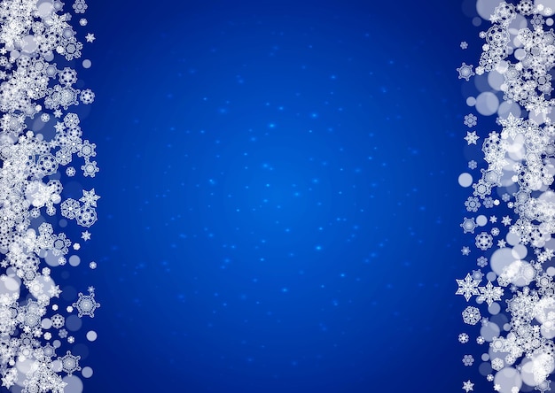 Snowflakes falling on blue background