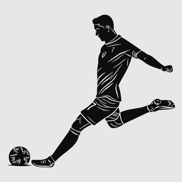 ゴールにボールを蹴るサッカー選手