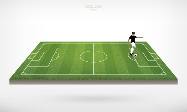 Soccer player and soccer football ball in soccer field .