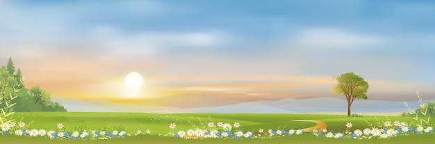 Spring landscape with mountain blue sky and clouds panorama green fields fresh and peaceful rural nature in springtime with green grass land