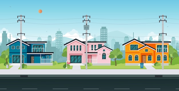 Stadshuizen met elektrische palen en kabel op straat.