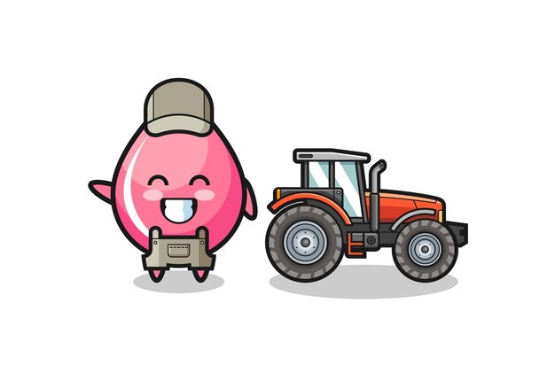 The strawberry juice drop farmer mascot standing beside a tractor