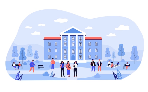 大学の建物の近くのキャンパスで時間を過ごす学生