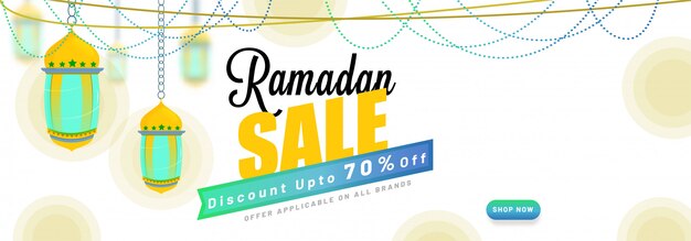 Stylish text Ramadan Sale, with hanging  lanterns. 