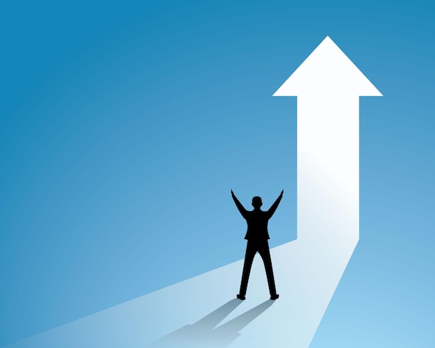 success businessman celebrating victory winning gesture in front of light gate symbol of achievement