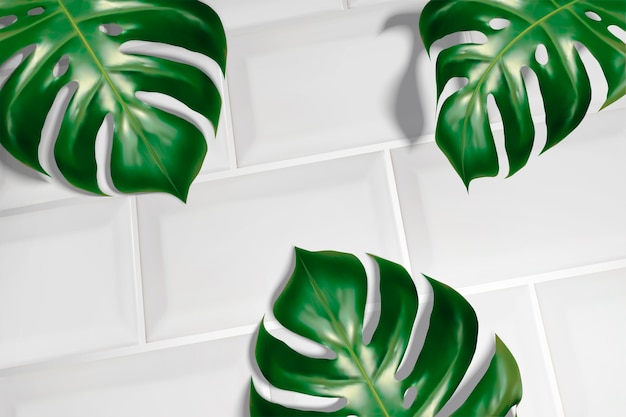 Summer background with tropical leaves on white tiles 