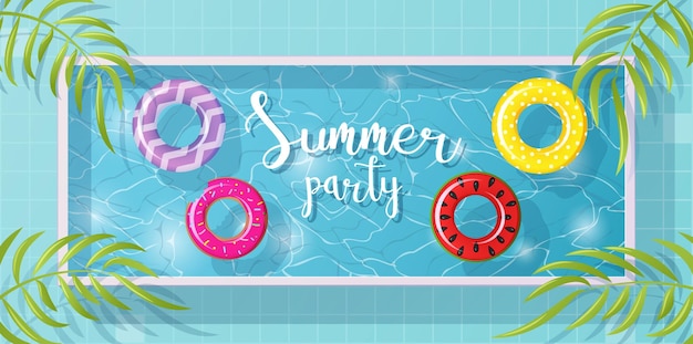 Summer time design with pool blue water and swimming rings pool with float and palm leaves top view