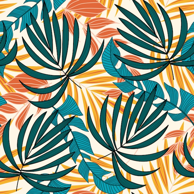 Summer trend seamless pattern with bright tropical leaves and plants