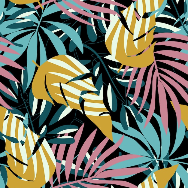 Summer trend seamless pattern with bright tropical leaves and plants