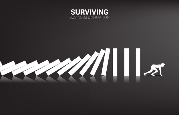 surviving business disruption. silhouette of businessman ready to run away from domino collapse. business industry disrupt