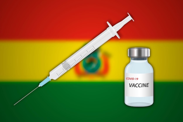 Siringa e flaconcino di vaccino su sfondo sfocato con bandiera della bolivia