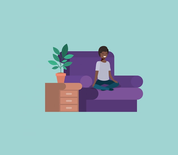 Adolescente ragazzo nero seduto in soggiorno