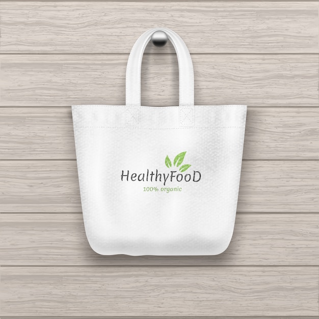 Vector textile  textured white tote with logo bag hanging on the wooden plank textured wall.