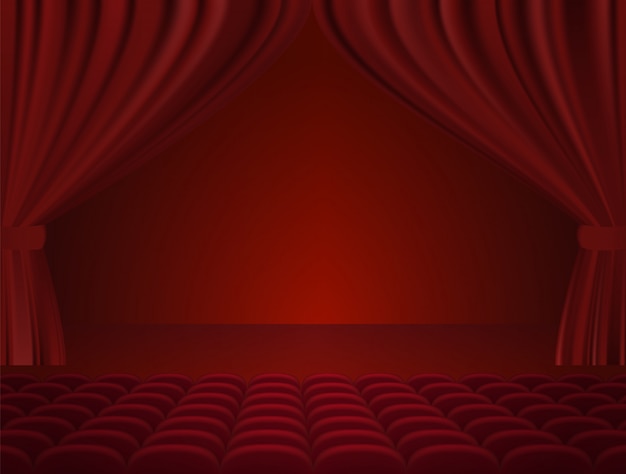 Theater interior with red curtains and seats.