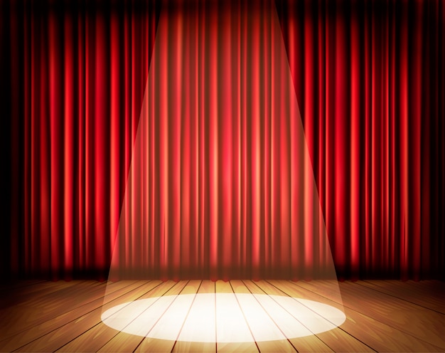 A theater stage with a red curtain and a spotlight.