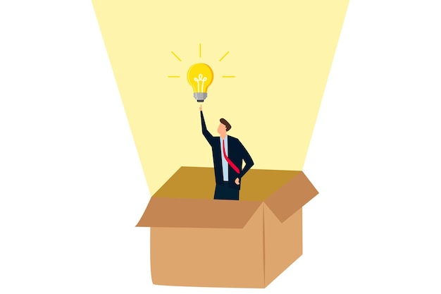 Думайте нестандартно, умный бизнесмен выходит из бумажной коробки с новой идеей лампочки освещения